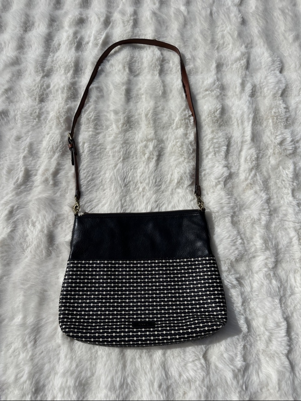 Fossil Fiona black and white printed crossbody bag featuring an adjustable strap